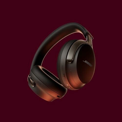 Bose headphones on a maroon background