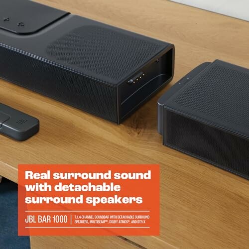 JBL Bar 1000 soundbar with detachable surround speakers on a table.