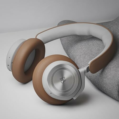 Luxury headphones with brown and gray design on a gray background