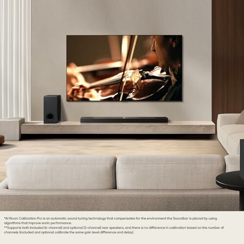 Modern living room with a large TV and soundbar.
