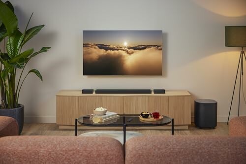 Modern living room with wall-mounted TV and stylish furniture.