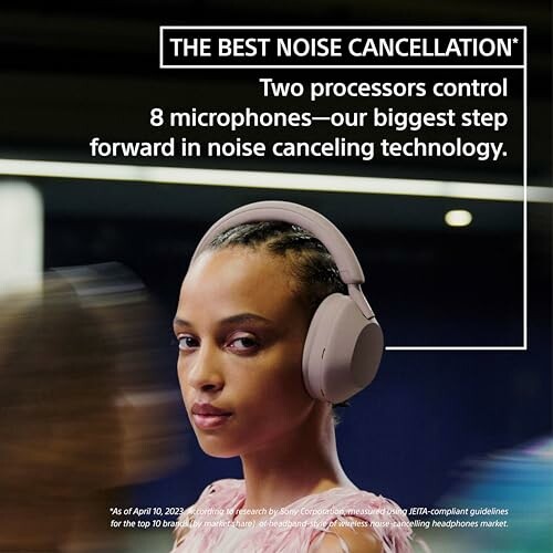 Person wearing headphones with noise cancellation features.