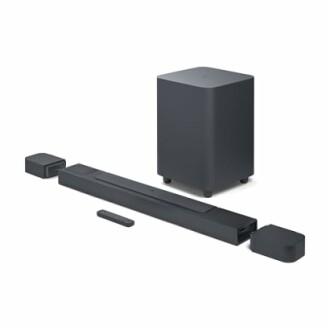 Home theater soundbar system with subwoofer and remote.