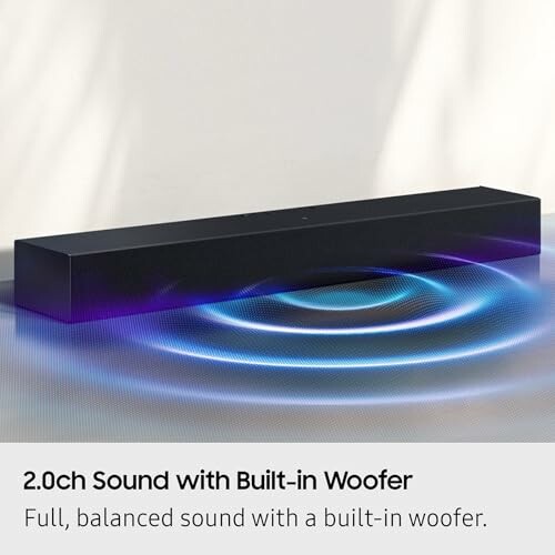 Black soundbar with built-in woofer and sound wave illustration.