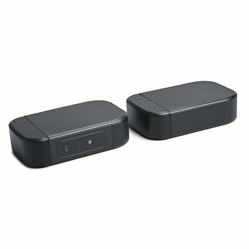 Pair of black wireless speakers